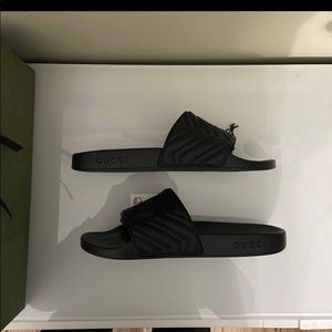 Gucci matelassé slides